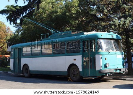 Beautiful retro trolleybus of production of times of the USSR of turquoise color. The resort city of Yalta, Crimea, Russia. Royalty-Free Stock Photo #1578824149