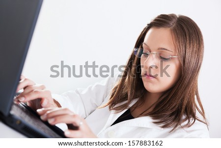 Close-up of a female doctor working in office
