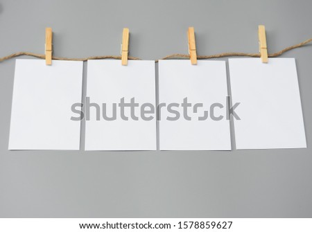 Set of paper banner, white mock-up paper card. blank paper with wood clip on gray background. corporate templates. brochure magazine isolated, use products business.