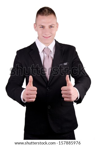 Businessman smiling with all right gesture in studio.