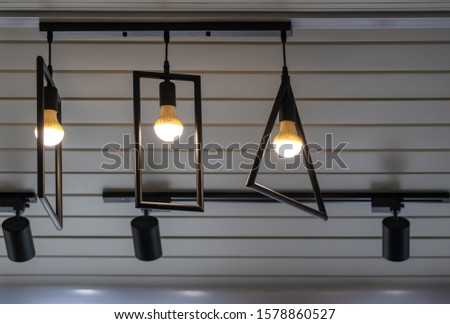 Modern ceiling lights bulbs lamp made of brass metal frame geometric shape interior and loft style decorating with white wooden wall