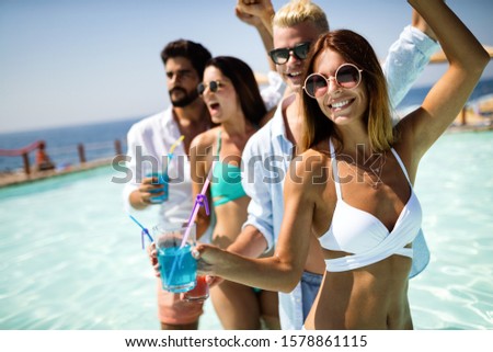 Group of friends having fun on summer vacation. Lifestyle, friendship, travel and holidays concept