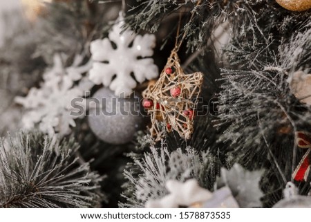 Christmas decoration in the shape of a star on a Christmas tree. postcard.