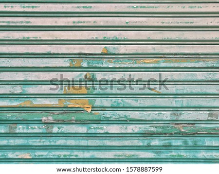 peeling paint on metal rolling shutter door background