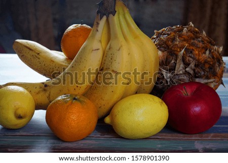 Different fruits on striped background