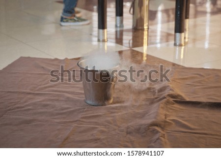 Steam of Nitrogen Created from Liquid Nitrogen Exposed to Temperatures . Chemical experiment, show with liquid nitrogen