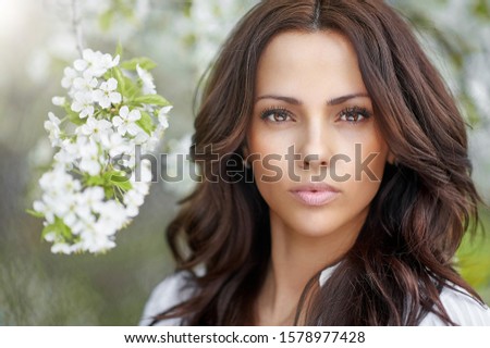 Beautiful young woman face closeup - perfect skin