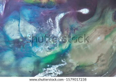 Abstract watercolor sea background. Dancing ocean paints, multi-colored streams of waves