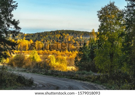 Autumn landscape in Karelia with road.  Karelia, Russia. 06.10, 2019. 