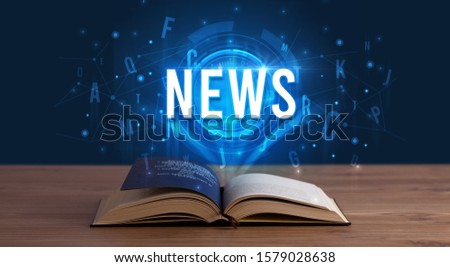 NEWS inscription coming out from an open book, digital technology concept