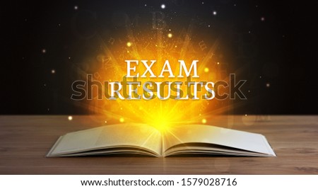 EXAM RESULTS inscription coming out from an open book, educational concept