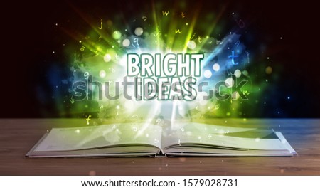 BRIGHT IDEAS inscription coming out from an open book, educational concept