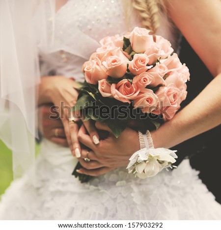 Bride and groom holding hands. Wedding. Royalty-Free Stock Photo #157903292