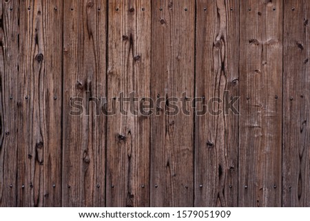 Dark wooden texture. Diagonal background brown wood planks.