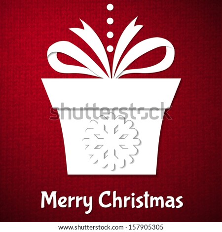 Christmas background with paper gift on red knitted background