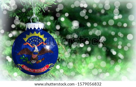 Christmas and New Year background with a flag State of North Dakota
