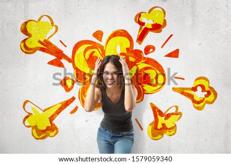 Young brunette woman in casual clothes making brain explosion gesture with cartoon explosion drawn on white wall background. People and objects. Feelings and emotions. Digital art.