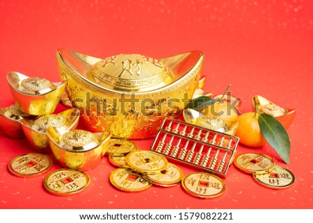 Chinese new year ornament--gold ingot,orange,golden coin and golden abacus,Chinese calligraphy Translation:good bless for new year