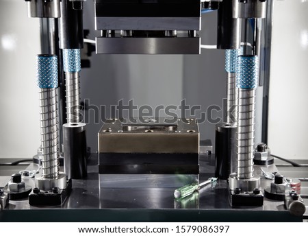 Hydraulic press stamping machine. Industrial metalwork machinery. Royalty-Free Stock Photo #1579086397