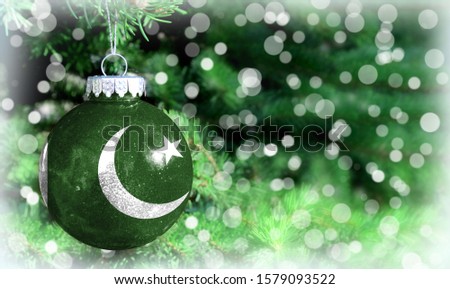 Christmas and New Year background with a flag of Pakistan