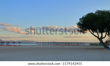 The photo was taken on the Spanish island - Palma de Mallorca. The picture shows an evening on the deserted beach of the island in the off-season.