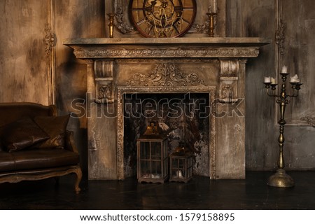 Dark fireplace in vintage style at old house