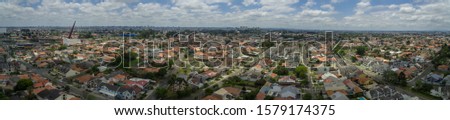 Jardim das Americas neighborhood of Curitiba in Parana, Brazil. Panoramic photo taken by drone on a beautiful sunny day with blue sky with some clouds.
