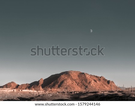red rock and moon, beautiful toned image