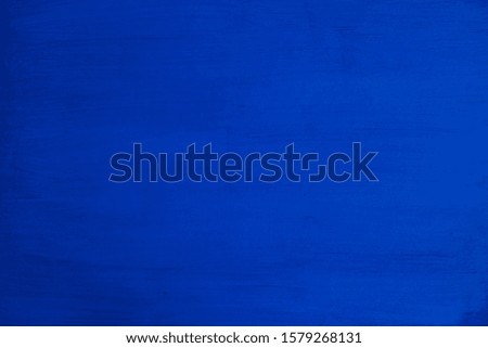The wall is painted with a blue paint paint structure like a background