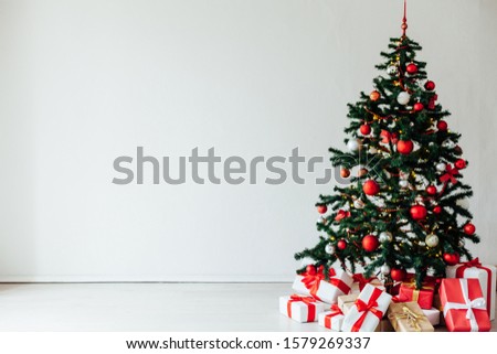 Christmas tree with red decor gifts for the new year holiday winter