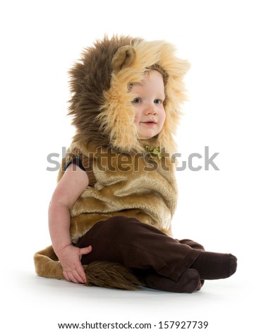 18-month-old baby boy in a lion costume for Halloween on white background