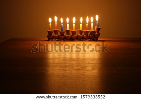 Hanukkah menorah glowing in the dark