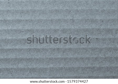 Gray paper structure. A high resolution photo of paper as a ready background or texture.