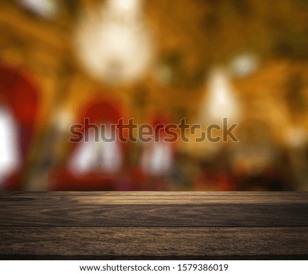 rustic wood table in front of christmas light night