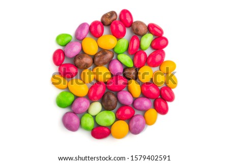 Pile of multicolored candies isolated on white background, chocolate dragees. close up, top view, flat lay.