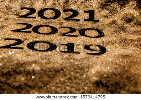 Beautiful sparkling Golden Numbers of 2019 to 2020 on black background for design, happy new year concept.