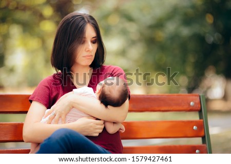 Sad Mother Suffering from Post Partum Depression Holding Baby. Young mom having postnatal baby blues anxiety and stress
 Royalty-Free Stock Photo #1579427461