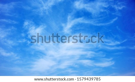 Blurred white clouds on the sky background.