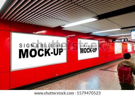 Mock up two blank horizontal billboard with clipping path placed near entrance and walkway in metro station, blurred people, empty space for advertising or information, advertising concept