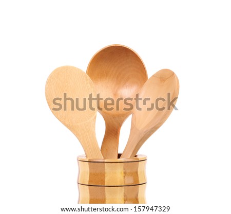 Wooden spoons in a jar. Isolated on a white background.