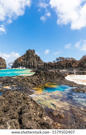 View of one of the stunning natural pools in Baia dos Porcos in Fernando de Noronha, Brazil