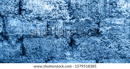 Blue color. Grey grunge textured wall. Copy space, grey concrete. 2020 year
