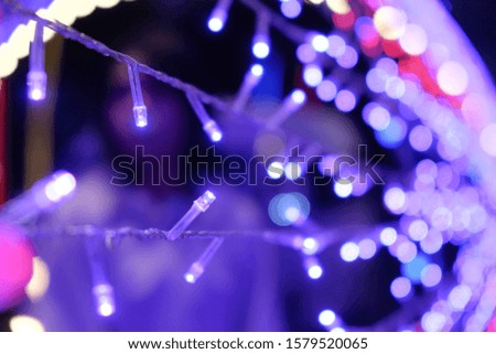 the abstract background, blurred light with the bokeh defocuses of purple and red light.