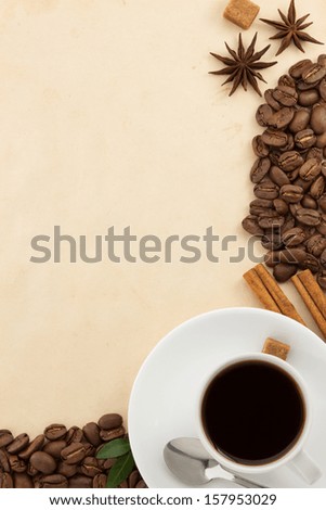 cup of coffee and parchment as background
