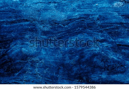 Top view of dark stone background in blue color.  Trendy color background.