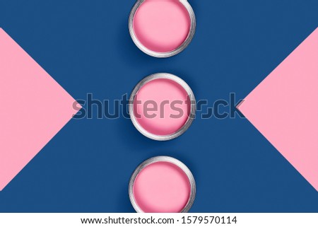 Repare picture. Blue and pink background with pink paint jars and corners. Flat lay, top view, copy space.