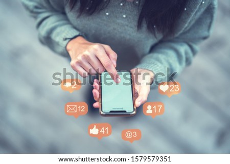 Close-up image of woman hands using smartphone and social network concept
