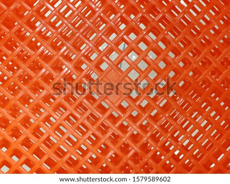 The floor of the grid patterned orange color basket 
