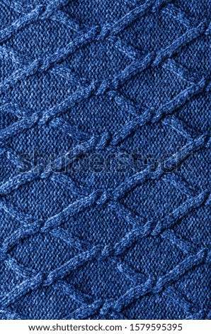Handmade Classic blue knitting wool texture background. Classic Blue Pantone color of the year 2020 
