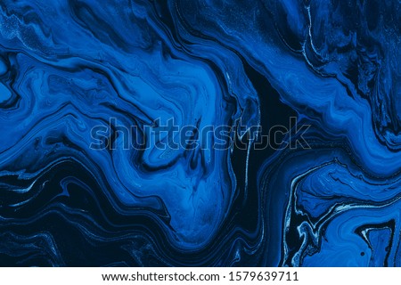 Classic blue color of the year 2020. Abstract fluid acrylic painting. Modern art. Marbled blue abstract background. Liquid marble pattern Royalty-Free Stock Photo #1579639711